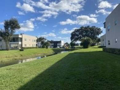 Great Location! True 1st floor with fabulous canal view on side on Kings Point Golf -Flanders Way in Florida - for sale on GolfHomes.com, golf home, golf lot