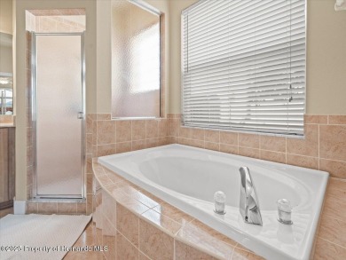 Located in Glen Lakes, this 2003 Addison Audubon maintenance on Glen Lakes Country Club in Florida - for sale on GolfHomes.com, golf home, golf lot