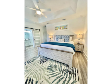 Located 1/2 MILE from sugar white sand beaches and pristine on Sharks Tooth Golf Club in Florida - for sale on GolfHomes.com, golf home, golf lot