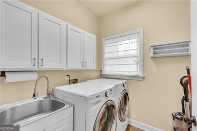 Resort-style living awaits in this beautifully appointed on Royal Lakes Golf and Country Club in Georgia - for sale on GolfHomes.com, golf home, golf lot