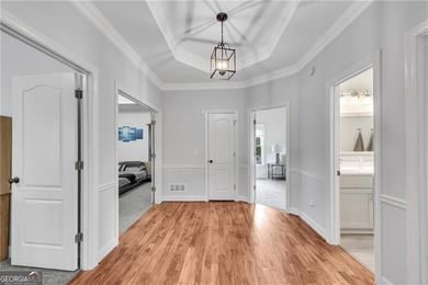 Resort-style living awaits in this beautifully appointed on Royal Lakes Golf and Country Club in Georgia - for sale on GolfHomes.com, golf home, golf lot