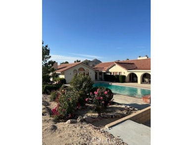 This is a beautiful custom built Spanish Style Home.  This home on Apple Valley Country Club in California - for sale on GolfHomes.com, golf home, golf lot