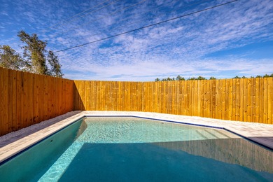 Located 1/2 MILE from sugar white sand beaches and pristine on Sharks Tooth Golf Club in Florida - for sale on GolfHomes.com, golf home, golf lot