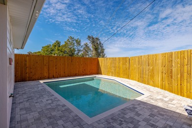 Located 1/2 MILE from sugar white sand beaches and pristine on Sharks Tooth Golf Club in Florida - for sale on GolfHomes.com, golf home, golf lot