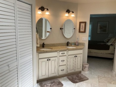 BEAUTIFULLY RENOVATED HURRICANE IMPACT WINDOWS NEW TRAVERTINE on Plantation Golf and Country Club in Florida - for sale on GolfHomes.com, golf home, golf lot