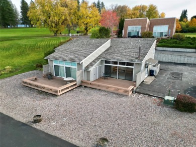 Check out this perfectly located 2 bedroom/2 bathroom unit, with on Polson Bay Golf Course - Championship Course in Montana - for sale on GolfHomes.com, golf home, golf lot