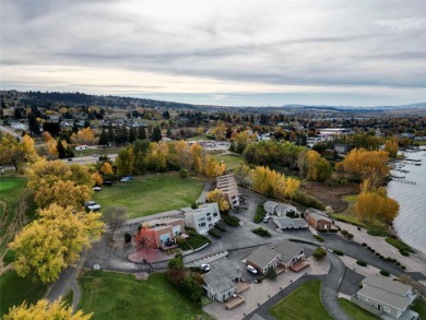 Check out this perfectly located 2 bedroom/2 bathroom unit, with on Polson Bay Golf Course - Championship Course in Montana - for sale on GolfHomes.com, golf home, golf lot