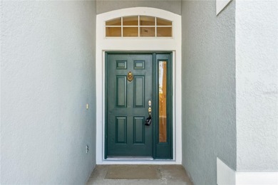 This stunning home is the perfect example of Florida retirement on Ridgewood Lakes Golf and Country Club in Florida - for sale on GolfHomes.com, golf home, golf lot