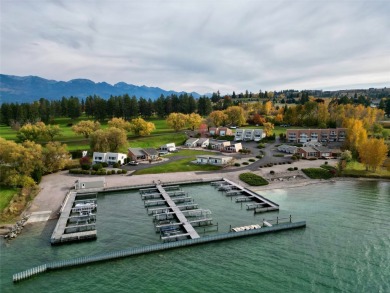 Check out this perfectly located 2 bedroom/2 bathroom unit, with on Polson Bay Golf Course - Championship Course in Montana - for sale on GolfHomes.com, golf home, golf lot