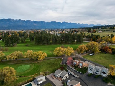 Check out this perfectly located 2 bedroom/2 bathroom unit, with on Polson Bay Golf Course - Championship Course in Montana - for sale on GolfHomes.com, golf home, golf lot