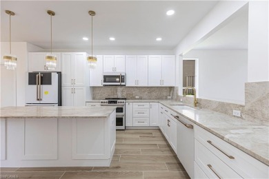 Fully Remodeled Lakeside Luxury in Troon Lakes at Pelican Marsh
 on Pelican Marsh Golf Club in Florida - for sale on GolfHomes.com, golf home, golf lot