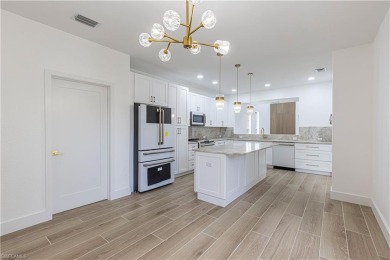 Fully Remodeled Lakeside Luxury in Troon Lakes at Pelican Marsh
 on Pelican Marsh Golf Club in Florida - for sale on GolfHomes.com, golf home, golf lot