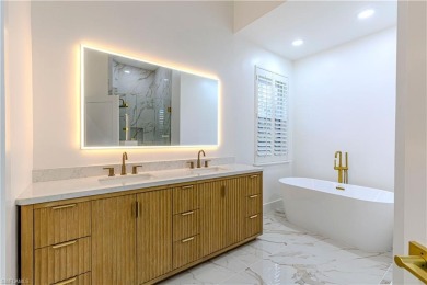 Fully Remodeled Lakeside Luxury in Troon Lakes at Pelican Marsh
 on Pelican Marsh Golf Club in Florida - for sale on GolfHomes.com, golf home, golf lot