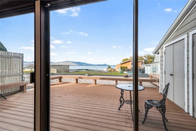 Check out this perfectly located 2 bedroom/2 bathroom unit, with on Polson Bay Golf Course - Championship Course in Montana - for sale on GolfHomes.com, golf home, golf lot