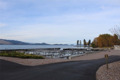 Check out this perfectly located 2 bedroom/2 bathroom unit, with on Polson Bay Golf Course - Championship Course in Montana - for sale on GolfHomes.com, golf home, golf lot