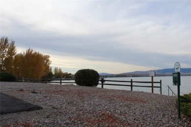 Check out this perfectly located 2 bedroom/2 bathroom unit, with on Polson Bay Golf Course - Championship Course in Montana - for sale on GolfHomes.com, golf home, golf lot