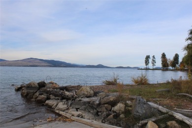 Check out this perfectly located 2 bedroom/2 bathroom unit, with on Polson Bay Golf Course - Championship Course in Montana - for sale on GolfHomes.com, golf home, golf lot