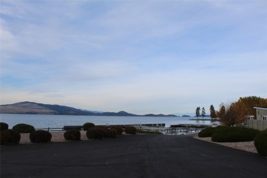 Check out this perfectly located 2 bedroom/2 bathroom unit, with on Polson Bay Golf Course - Championship Course in Montana - for sale on GolfHomes.com, golf home, golf lot