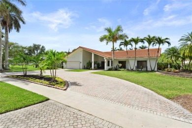 Discover lakeside serenity in this captivating Saddie Club on Bonaventure Country Club in Florida - for sale on GolfHomes.com, golf home, golf lot