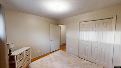 Welcome to this beautiful 3-bedroom, 2-bath tri-level located on on Paradise Valley Country Club in Wyoming - for sale on GolfHomes.com, golf home, golf lot