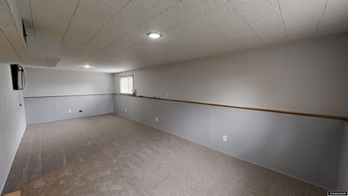 Welcome to this beautiful 3-bedroom, 2-bath tri-level located on on Paradise Valley Country Club in Wyoming - for sale on GolfHomes.com, golf home, golf lot