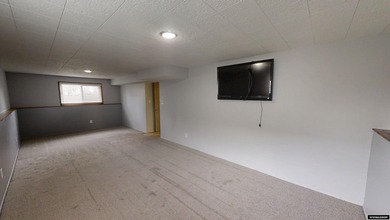 Welcome to this beautiful 3-bedroom, 2-bath tri-level located on on Paradise Valley Country Club in Wyoming - for sale on GolfHomes.com, golf home, golf lot