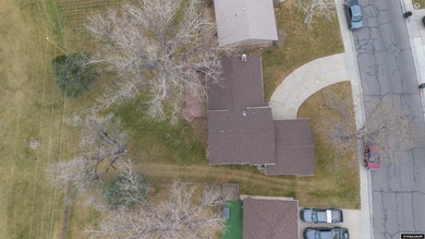 Welcome to this beautiful 3-bedroom, 2-bath tri-level located on on Paradise Valley Country Club in Wyoming - for sale on GolfHomes.com, golf home, golf lot