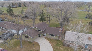 Welcome to this beautiful 3-bedroom, 2-bath tri-level located on on Paradise Valley Country Club in Wyoming - for sale on GolfHomes.com, golf home, golf lot