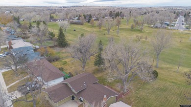 Welcome to this beautiful 3-bedroom, 2-bath tri-level located on on Paradise Valley Country Club in Wyoming - for sale on GolfHomes.com, golf home, golf lot