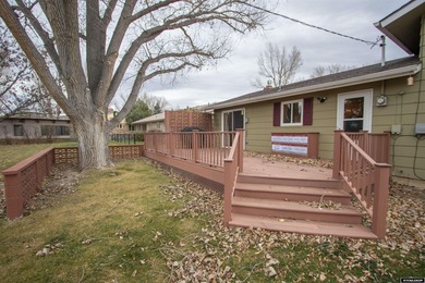 Welcome to this beautiful 3-bedroom, 2-bath tri-level located on on Paradise Valley Country Club in Wyoming - for sale on GolfHomes.com, golf home, golf lot