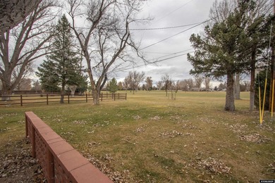 Welcome to this beautiful 3-bedroom, 2-bath tri-level located on on Paradise Valley Country Club in Wyoming - for sale on GolfHomes.com, golf home, golf lot