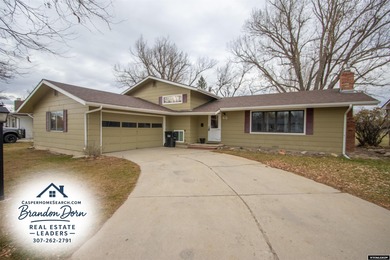 Welcome to this beautiful 3-bedroom, 2-bath tri-level located on on Paradise Valley Country Club in Wyoming - for sale on GolfHomes.com, golf home, golf lot