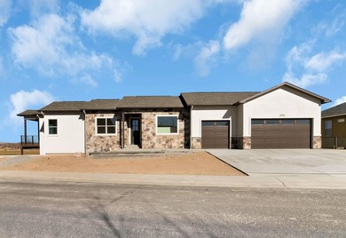 Brand new construction backing directly to the beautiful Chipeta on Chipeta Golf Course At Orchard Mesa in Colorado - for sale on GolfHomes.com, golf home, golf lot