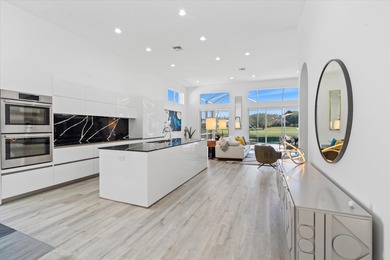 Stunningly renovated home located on two fairways of the Eagle on TPC Eagle Trace in Florida - for sale on GolfHomes.com, golf home, golf lot