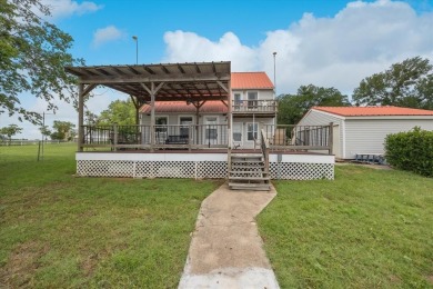 This beautiful lakefront home boasts of 2,605 sf of space on The Club At Runaway Bay in Texas - for sale on GolfHomes.com, golf home, golf lot