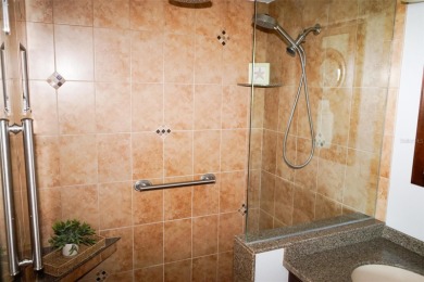 Two-bedroom, two-bath penthouse condo with extra room/office at on Isla Del Sol Yacht and Country Club in Florida - for sale on GolfHomes.com, golf home, golf lot