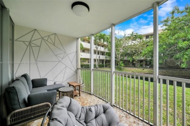 Discover the perfect first-floor corner unit with a tranquil on Presidential Estate Golf Course in Florida - for sale on GolfHomes.com, golf home, golf lot