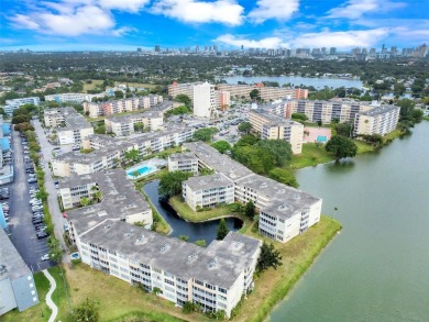 Discover the perfect first-floor corner unit with a tranquil on Presidential Estate Golf Course in Florida - for sale on GolfHomes.com, golf home, golf lot