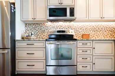 Two-bedroom, two-bath penthouse condo with extra room/office at on Isla Del Sol Yacht and Country Club in Florida - for sale on GolfHomes.com, golf home, golf lot