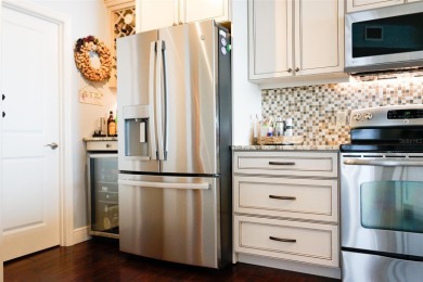 Two-bedroom, two-bath penthouse condo with extra room/office at on Isla Del Sol Yacht and Country Club in Florida - for sale on GolfHomes.com, golf home, golf lot