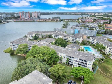 Discover the perfect first-floor corner unit with a tranquil on Presidential Estate Golf Course in Florida - for sale on GolfHomes.com, golf home, golf lot