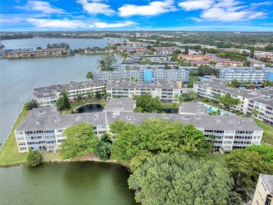 Discover the perfect first-floor corner unit with a tranquil on Presidential Estate Golf Course in Florida - for sale on GolfHomes.com, golf home, golf lot