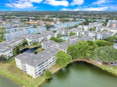 Discover the perfect first-floor corner unit with a tranquil on Presidential Estate Golf Course in Florida - for sale on GolfHomes.com, golf home, golf lot