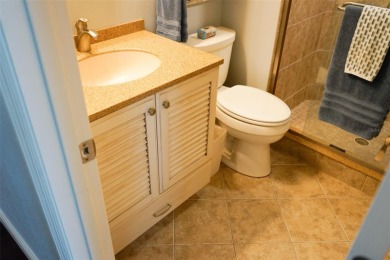 Two-bedroom, two-bath penthouse condo with extra room/office at on Isla Del Sol Yacht and Country Club in Florida - for sale on GolfHomes.com, golf home, golf lot