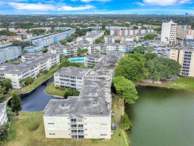 Discover the perfect first-floor corner unit with a tranquil on Presidential Estate Golf Course in Florida - for sale on GolfHomes.com, golf home, golf lot