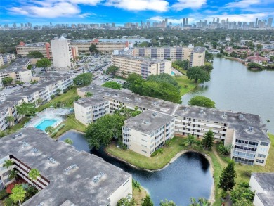 Discover the perfect first-floor corner unit with a tranquil on Presidential Estate Golf Course in Florida - for sale on GolfHomes.com, golf home, golf lot