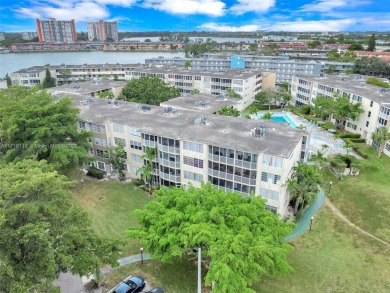 Discover the perfect first-floor corner unit with a tranquil on Presidential Estate Golf Course in Florida - for sale on GolfHomes.com, golf home, golf lot