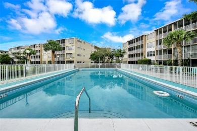 Discover the perfect first-floor corner unit with a tranquil on Presidential Estate Golf Course in Florida - for sale on GolfHomes.com, golf home, golf lot