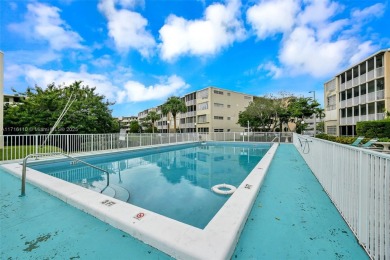 Discover the perfect first-floor corner unit with a tranquil on Presidential Estate Golf Course in Florida - for sale on GolfHomes.com, golf home, golf lot