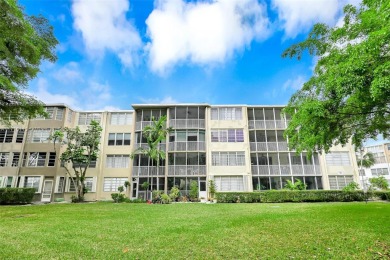 Discover the perfect first-floor corner unit with a tranquil on Presidential Estate Golf Course in Florida - for sale on GolfHomes.com, golf home, golf lot